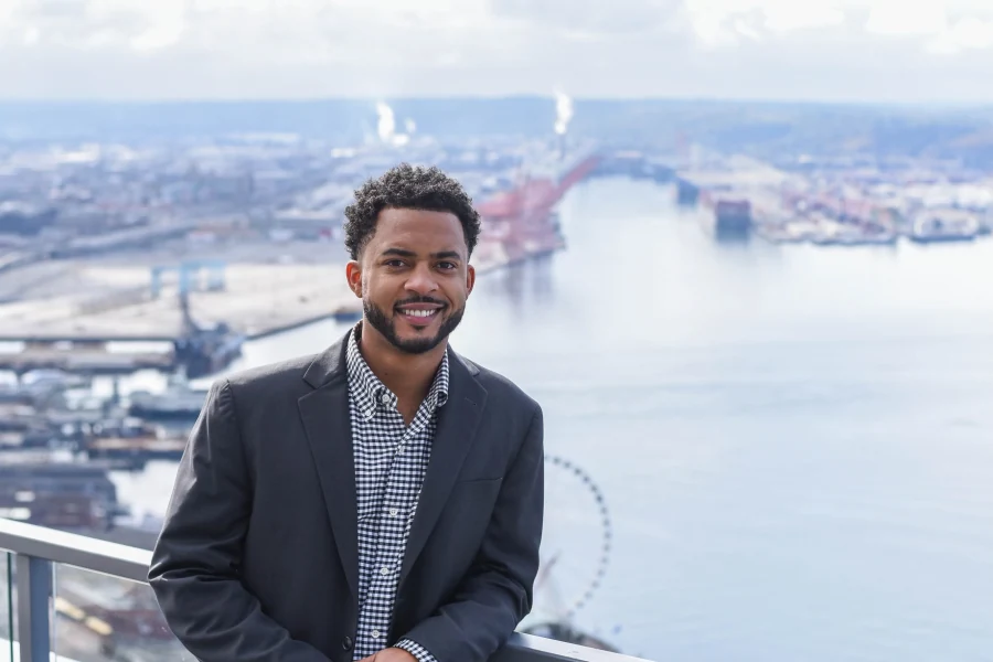 Chandler Walker Gayton on a Seattle rooftop overlooking the waterfront