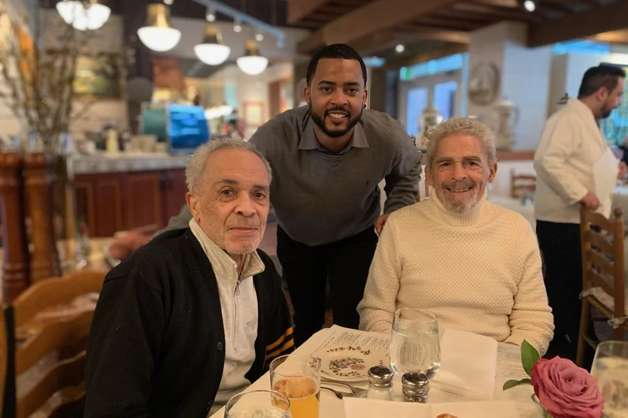 Chandler with family at a restaurant dinner