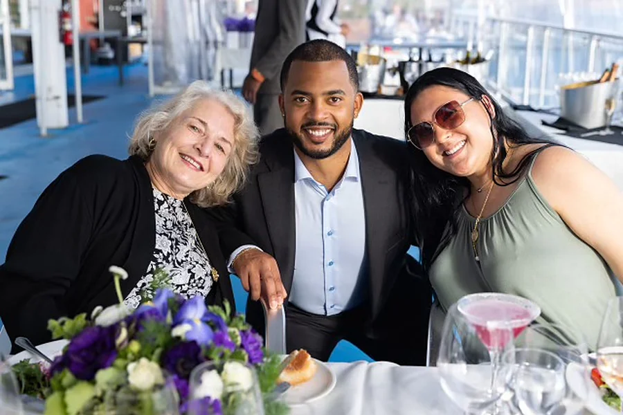 Chandler with family at a waterfront dinner