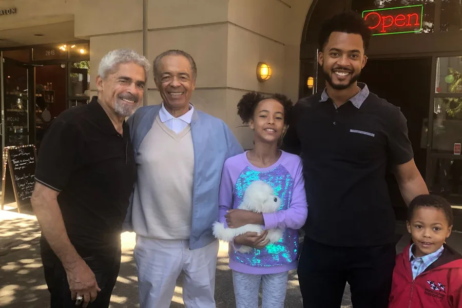 Chandler with family outside a neighborhood salon