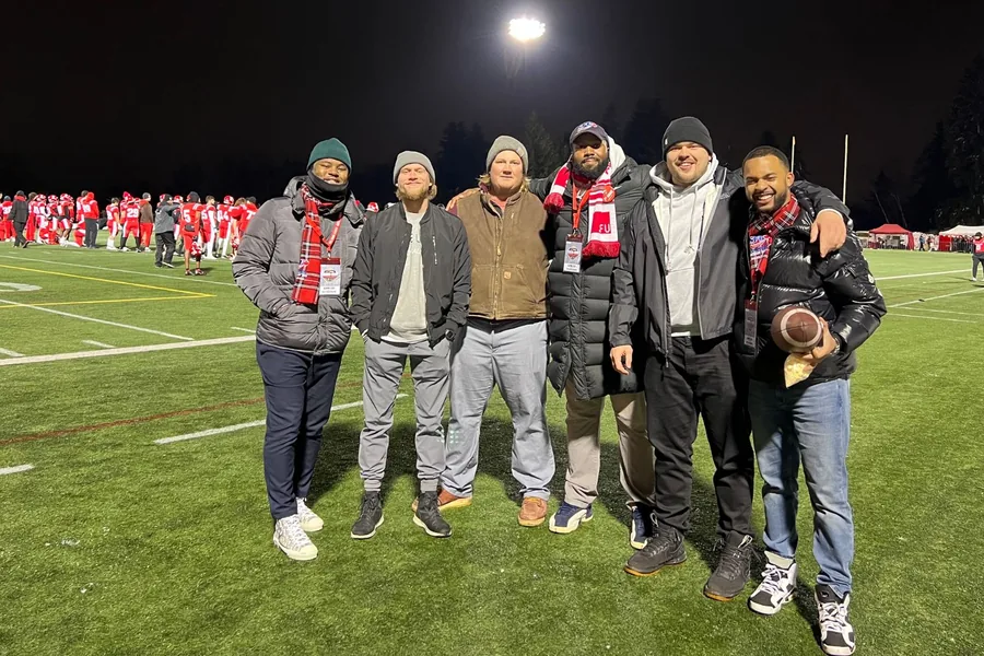 Chandler with friends at a night football game