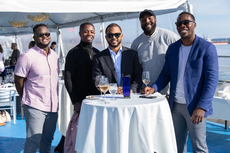 Chandler with friends at a waterfront celebration