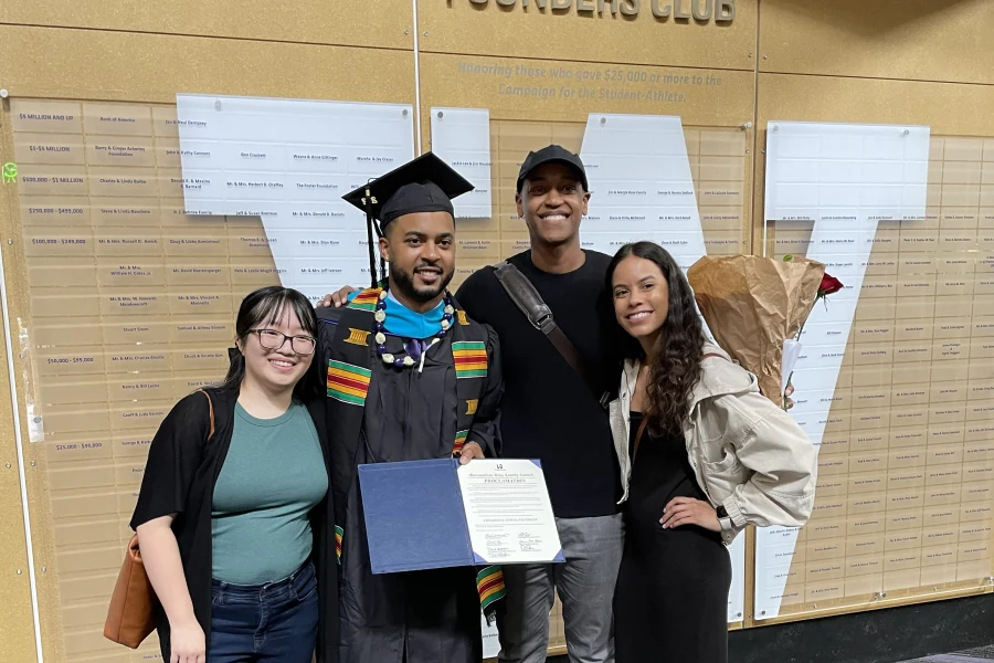 Chandler with family on graduation day